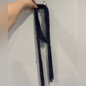 Beautiful woven scarf in black blue and purple.